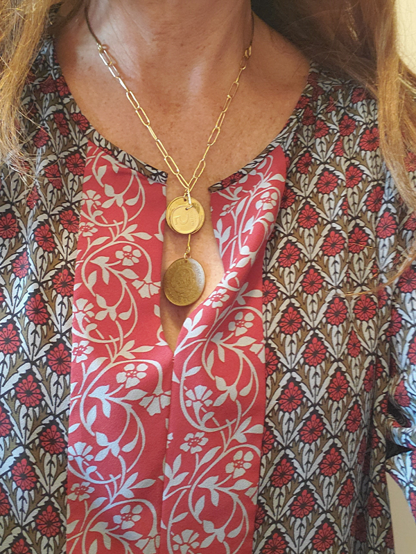patterned top with gold coin necklace
